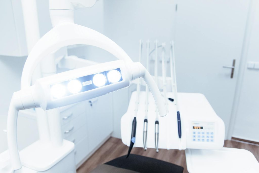 white dental equipment near wall