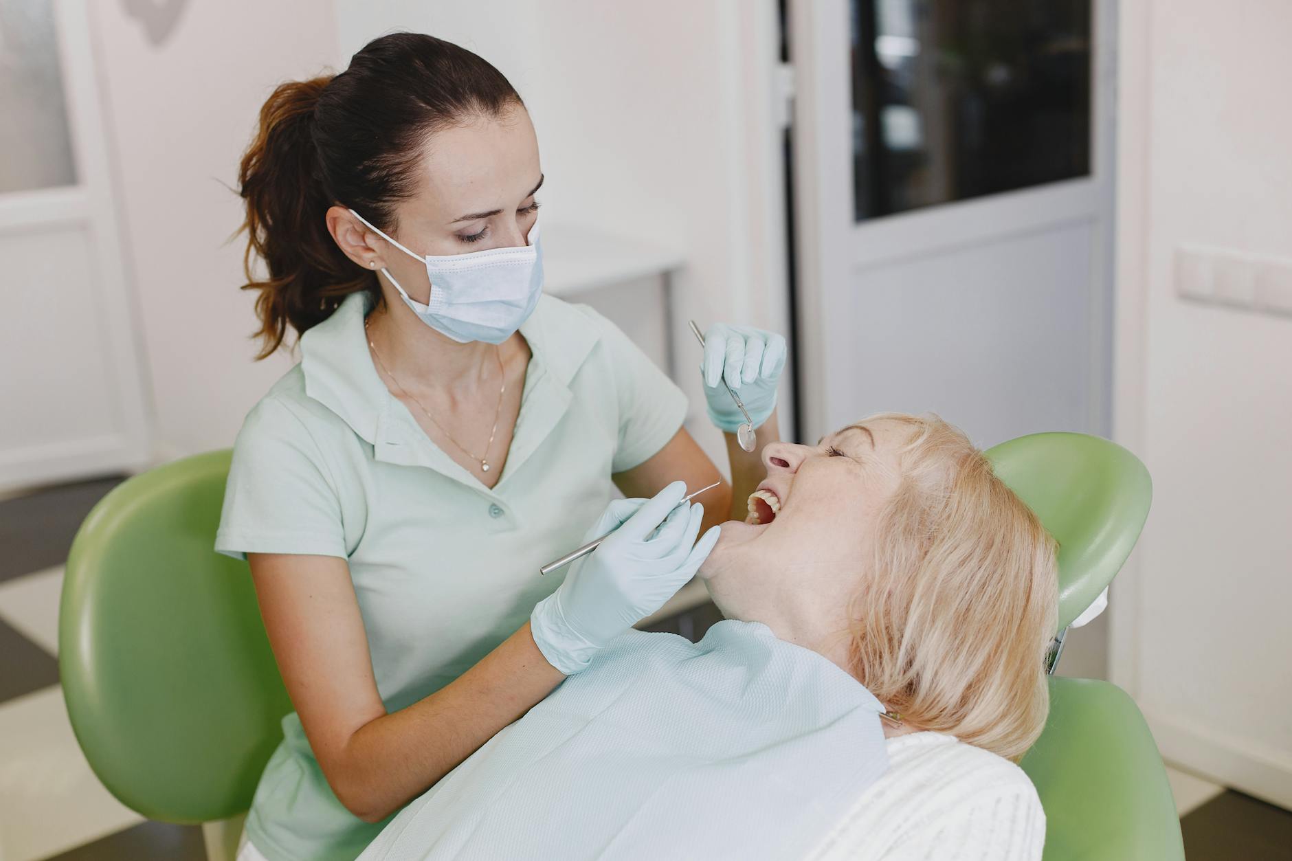 dentist with patient in office